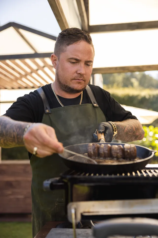 Steven Cook filming TVNZ Cooks on Fire as head pitmaster of Cook Cartel